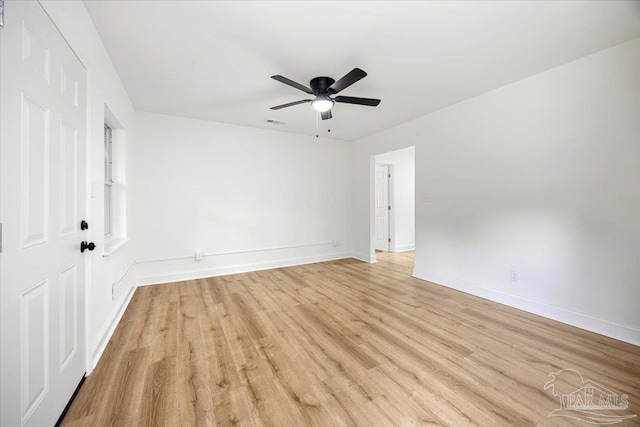 spare room featuring light hardwood / wood-style floors and ceiling fan