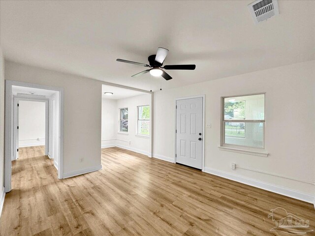 spare room featuring light wood-type flooring and ceiling fan