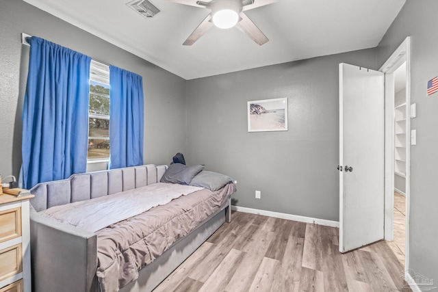 bedroom featuring light hardwood / wood-style flooring and ceiling fan