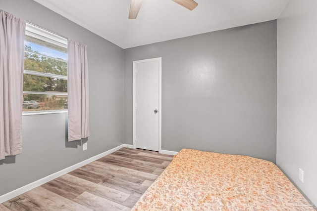 unfurnished bedroom featuring ceiling fan and light hardwood / wood-style floors