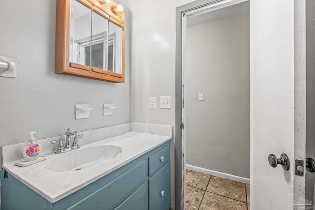 bathroom with tile patterned flooring and vanity