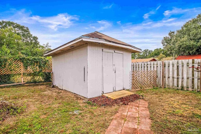 view of outdoor structure with a lawn