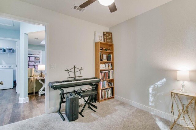 home office featuring carpet, ceiling fan, and washer / clothes dryer