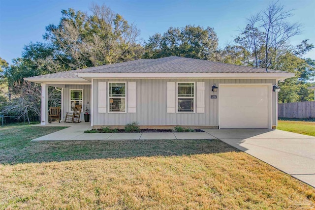 ranch-style home with a front lawn and a garage