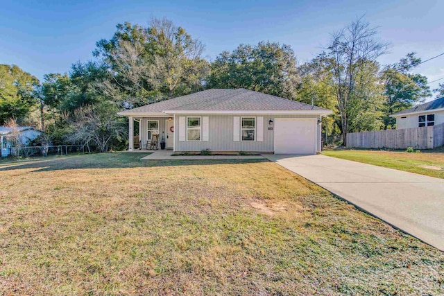 ranch-style home featuring a porch, a garage, and a front lawn