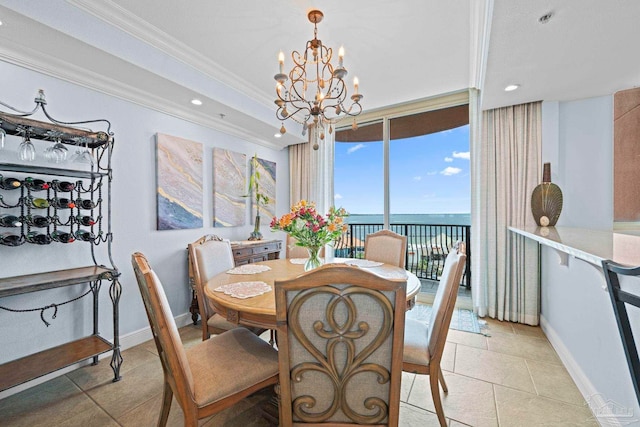 721 Pensacola Beach Blvd Unit 702, Pensacola Beach, FL 32561 - dining space featuring crown molding, a chandelier, light tile patterned flooring, recessed lighting, and a water view