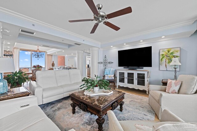 721 Pensacola Beach Blvd Unit 702, Pensacola Beach, FL 32561 - living room featuring ornamental molding, ceiling fan, a raised ceiling, decorative columns, and wood finished floors