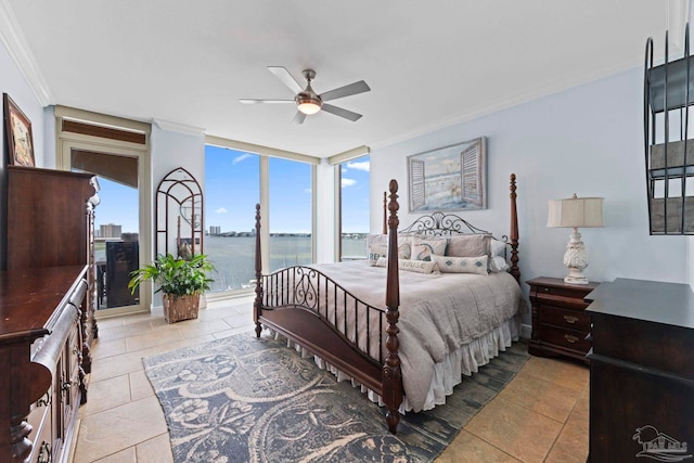721 Pensacola Beach Blvd Unit 702, Pensacola Beach, FL 32561 - bedroom featuring crown molding, multiple windows, a water view, ceiling fan, and tile patterned floors