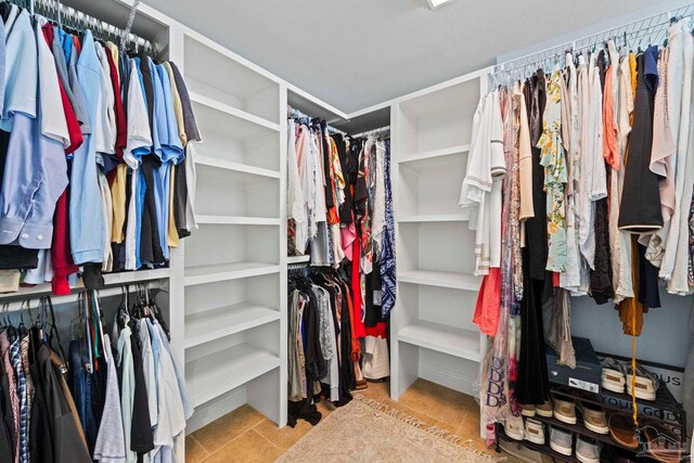 721 Pensacola Beach Blvd Unit 702, Pensacola Beach, FL 32561 - walk in closet featuring tile patterned floors