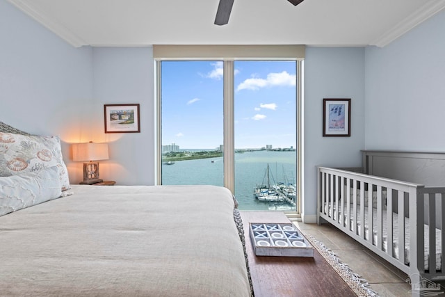 721 Pensacola Beach Blvd Unit 702, Pensacola Beach, FL 32561 - bedroom featuring a water view, ornamental molding, tile patterned flooring, ceiling fan, and access to exterior