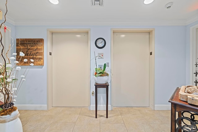 721 Pensacola Beach Blvd Unit 702, Pensacola Beach, FL 32561 - foyer entrance featuring elevator, crown molding, and tile patterned floors