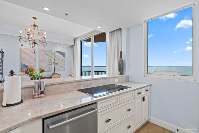 721 Pensacola Beach Blvd Unit 702, Pensacola Beach, FL 32561 - kitchen featuring stainless steel dishwasher, a chandelier, healthy amount of natural light, white cabinetry, and ornamental molding