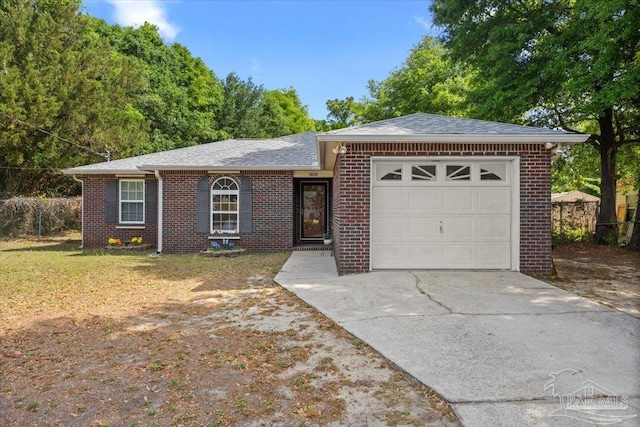 ranch-style house featuring concrete driveway, roof with shingles, an attached garage, and brick siding