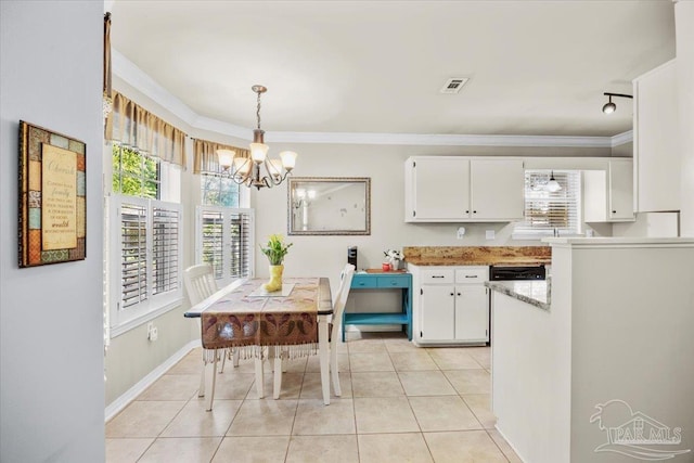 kitchen with light tile patterned flooring, crown molding, a notable chandelier, and white cabinets
