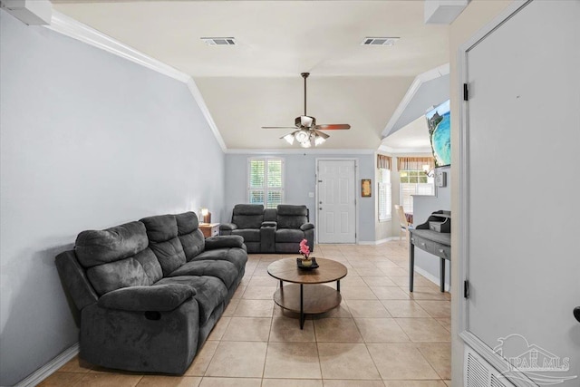 living room featuring crown molding, light tile patterned floors, ceiling fan, and vaulted ceiling