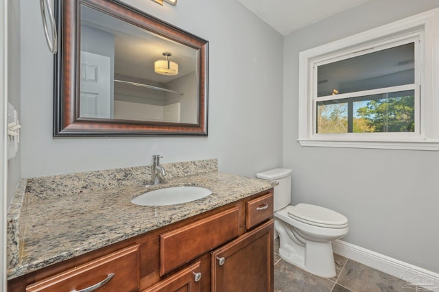 4900 Shell Rd, Milton, FL 32583 - full bathroom featuring vanity, toilet, and baseboards