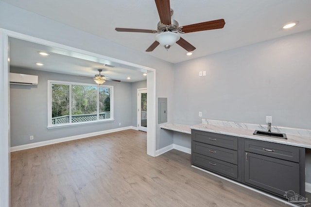 4900 Shell Rd, Milton, FL 32583 - interior space featuring a ceiling fan, wood finished floors, baseboards, and a wall mounted AC
