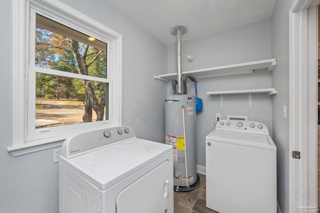 4900 Shell Rd, Milton, FL 32583 - washroom featuring gas water heater, independent washer and dryer, and laundry area