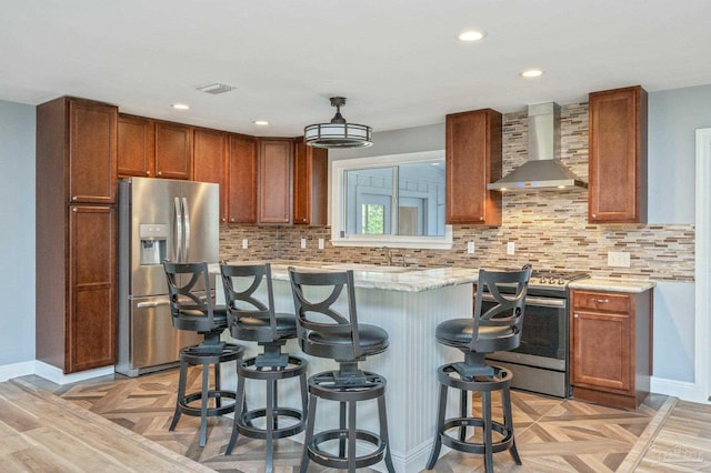 4900 Shell Rd, Milton, FL 32583 - kitchen with backsplash, a center island, wall chimney range hood, a kitchen breakfast bar, and stainless steel appliances
