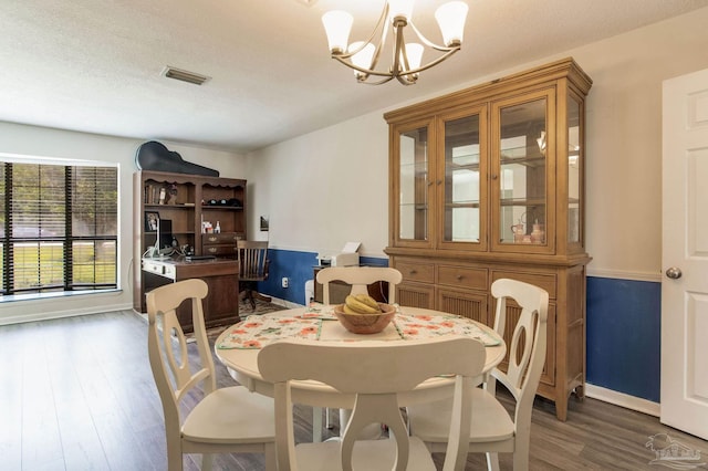 5945 Pamela Dr, Milton, FL 32570 - dining space with a chandelier, wood finished floors, and baseboards