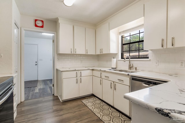 5945 Pamela Dr, Milton, FL 32570 - kitchen with a sink, decorative backsplash, white cabinetry, wood finished floors, and electric range