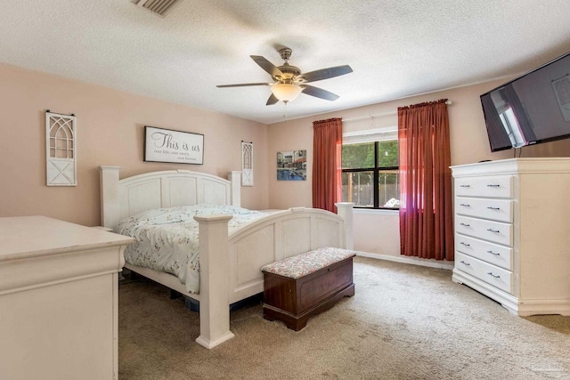5945 Pamela Dr, Milton, FL 32570 - bedroom with light colored carpet, a textured ceiling, and a ceiling fan