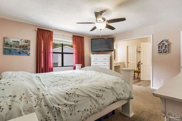 5945 Pamela Dr, Milton, FL 32570 - carpeted bedroom featuring a textured ceiling and ceiling fan