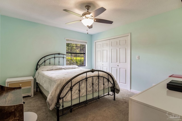 5945 Pamela Dr, Milton, FL 32570 - bedroom featuring carpet floors, a closet, a ceiling fan, a textured ceiling, and baseboards