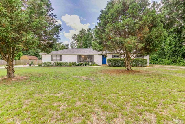 5945 Pamela Dr, Milton, FL 32570 - ranch-style house with stucco siding