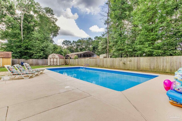 5945 Pamela Dr, Milton, FL 32570 - view of swimming pool featuring a fenced backyard, a patio, and view of scattered trees