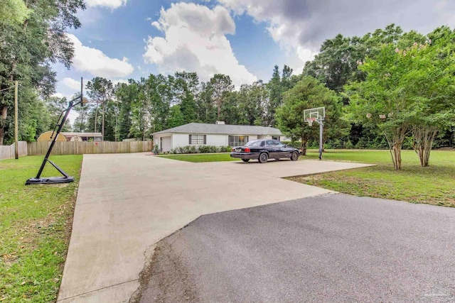 5945 Pamela Dr, Milton, FL 32570 - view of front facade featuring driveway and view of wooded area
