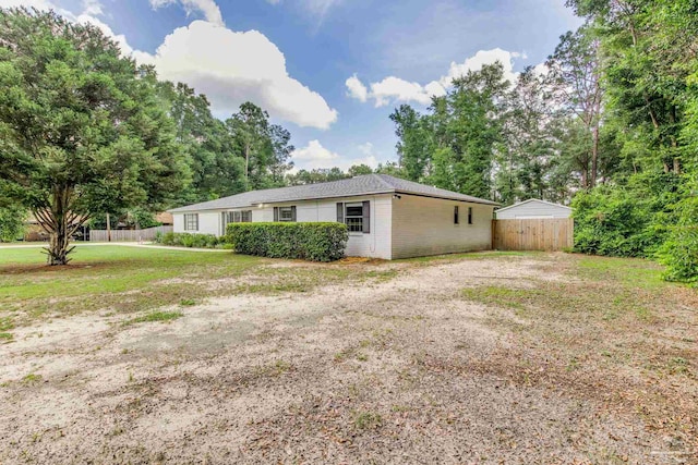5945 Pamela Dr, Milton, FL 32570 - view of side of home featuring brick siding