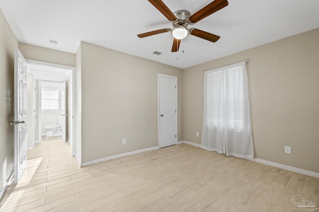 unfurnished bedroom featuring ceiling fan, light hardwood / wood-style floors, and ensuite bathroom