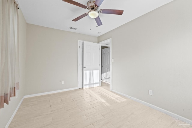 spare room with ceiling fan