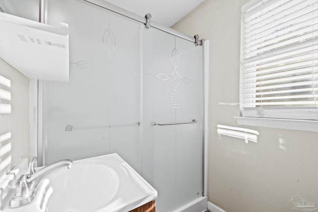 bathroom with vanity and an enclosed shower