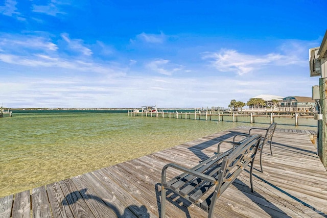 wooden terrace with a boat dock