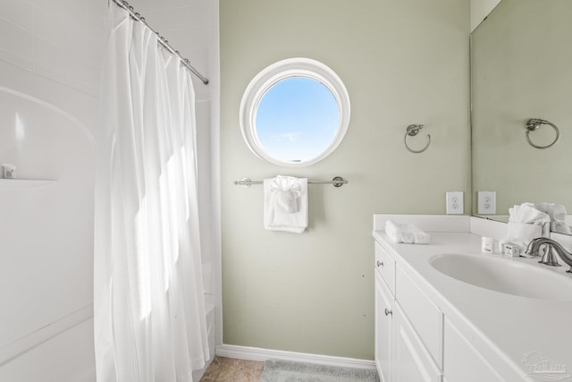 bathroom with vanity and shower / tub combo with curtain