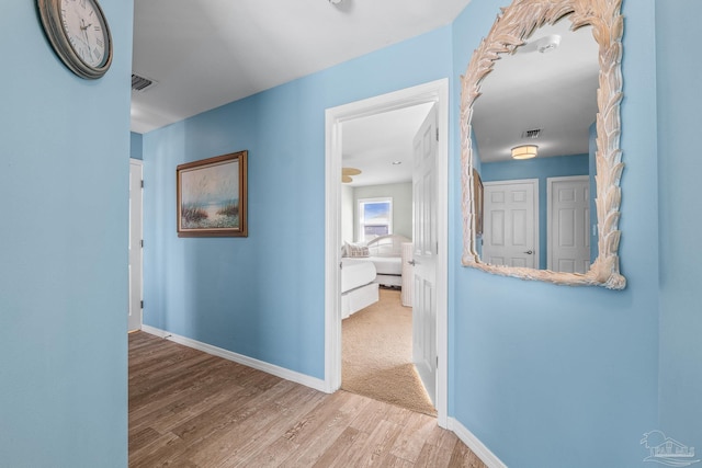 corridor featuring hardwood / wood-style floors