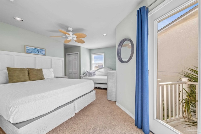 carpeted bedroom with ceiling fan and a closet