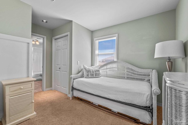 carpeted bedroom with a closet