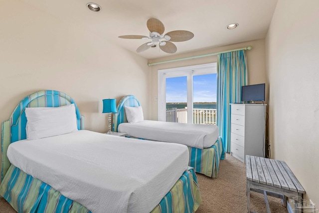 bedroom with ceiling fan, carpet floors, and access to outside