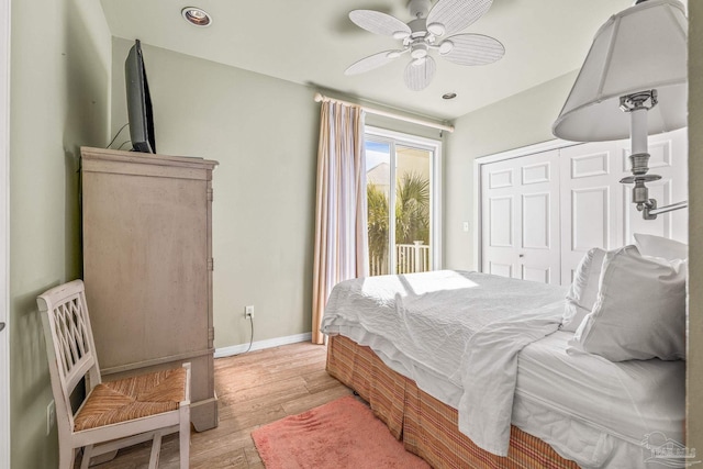 bedroom featuring ceiling fan, a closet, light hardwood / wood-style flooring, and access to outside