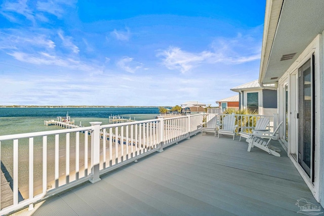 balcony featuring a water view