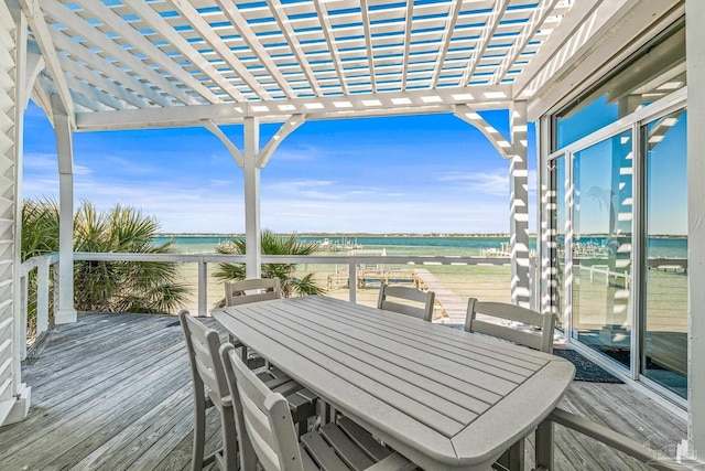 wooden deck featuring a water view, a beach view, and a pergola