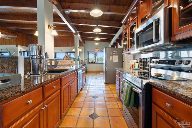 kitchen with beam ceiling, sink, stainless steel appliances, and wood ceiling