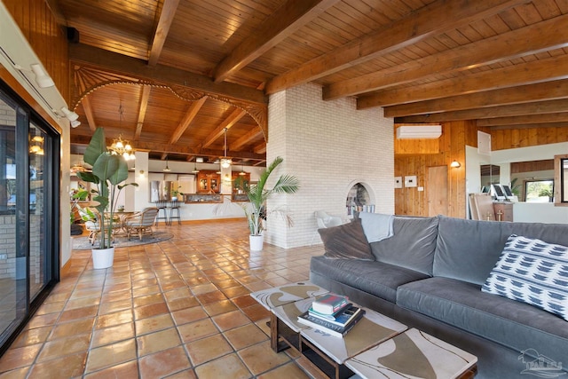 interior space featuring wood walls, a wall unit AC, beam ceiling, a chandelier, and wooden ceiling