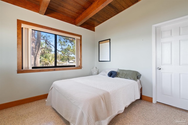 bedroom with wood ceiling and vaulted ceiling with beams