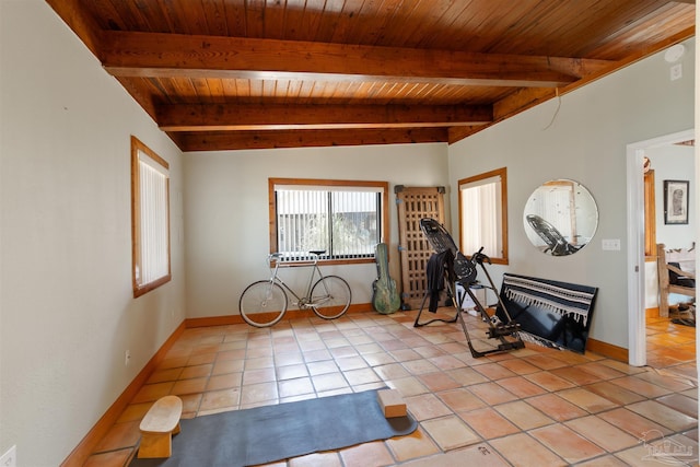 interior space featuring light tile patterned flooring and wood ceiling