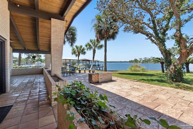 view of patio featuring a water view