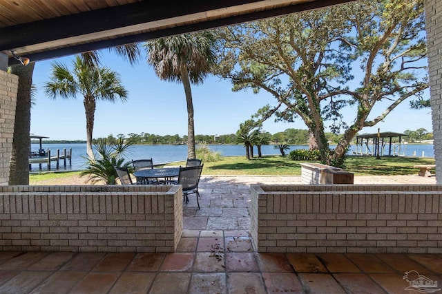 view of patio with outdoor lounge area and a water view